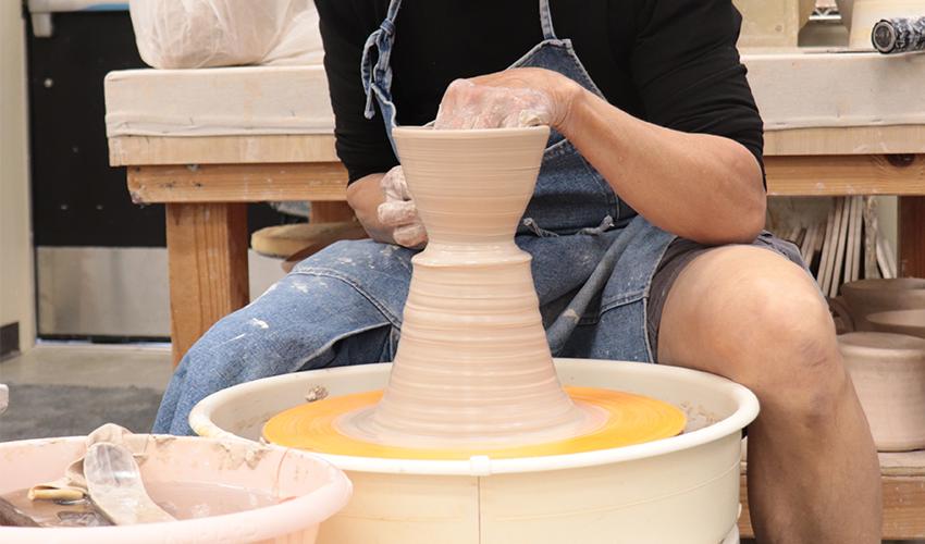 Mr. V. Chin making a ceramic bowl.